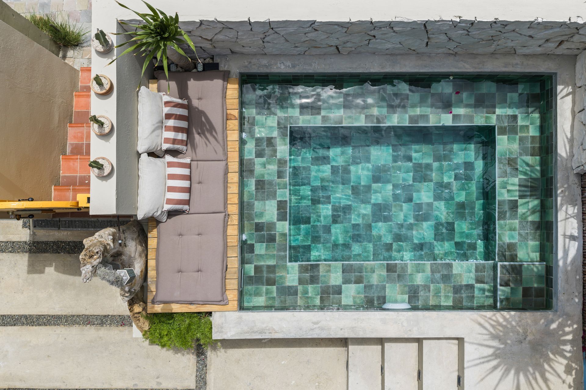 Beautiful lady sunbathing in the small pool