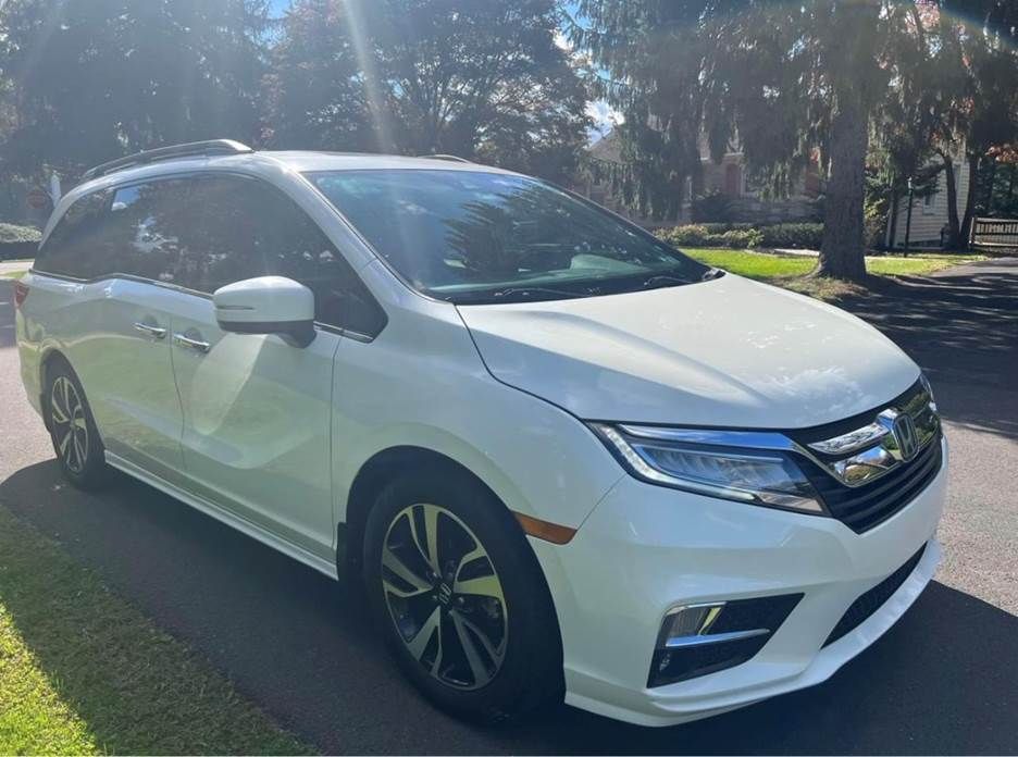 A white car with a black bumper is on a white background.