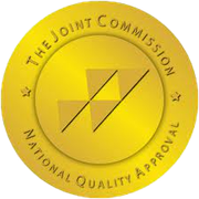 The joint commission national quality approval seal is a gold circle with a triangle in the center.