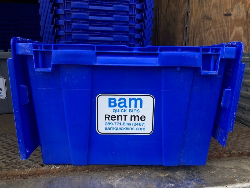 Blue plastic moving crate with 