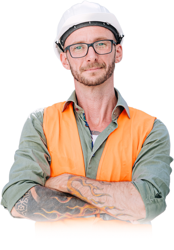 Construction worker in a white hard hat and orange vest, arms crossed, wearing glasses and a patterned sleeve tattoo.