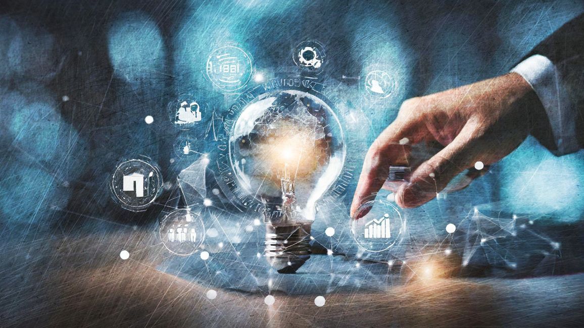 a person is holding a light bulb in their hand .