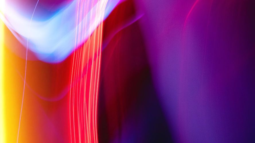 a close up of a colorful light painting with a purple background .