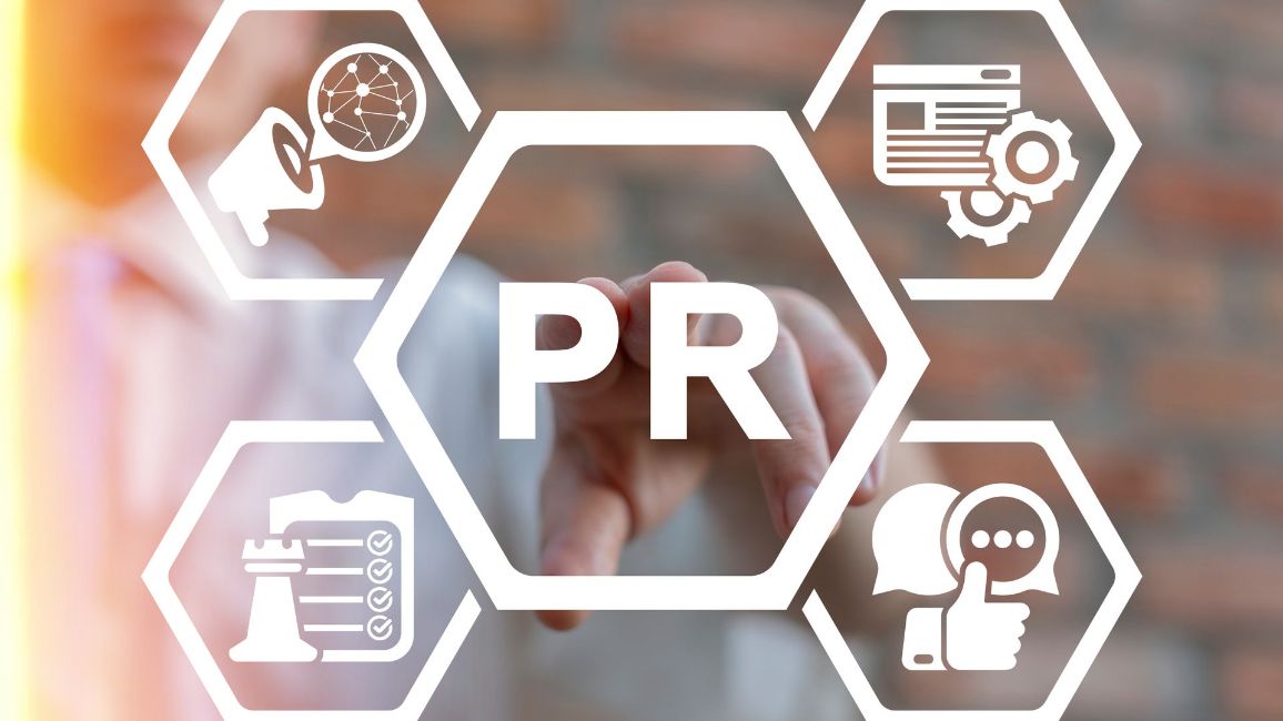 a person is pressing a button on a screen that says pr .
