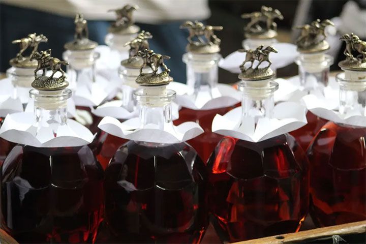 bottles with horses on top of them