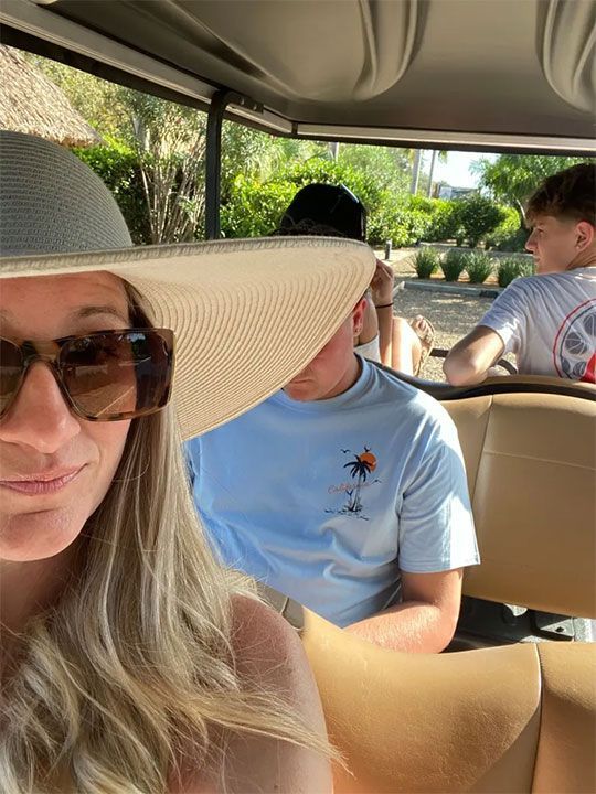woman wearing a hat and sunglasses