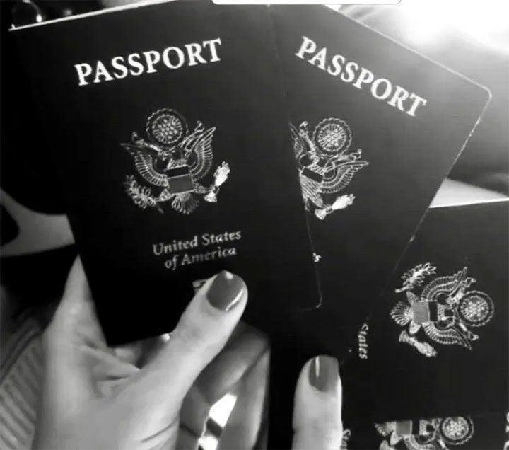 Hand holding several US passports. What To Do If You Discover Your Expired Passport (Yes, It Happens