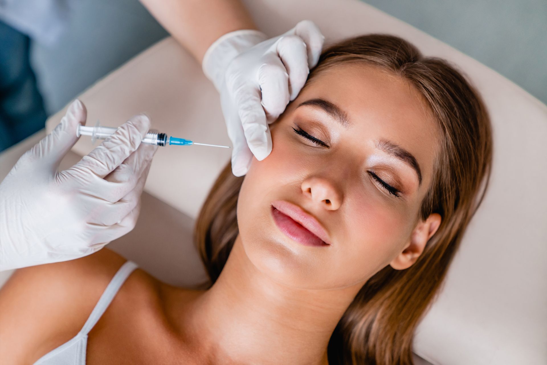 Woman getting cosmetic injections.