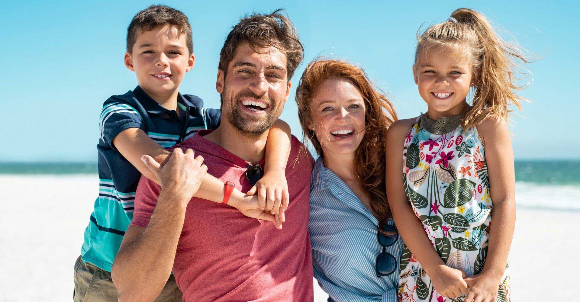Happy Family at the Beach — Fort Gratiot, MI — Hamzavi Dermatology & Dermatology Specialists Happy Family at the Beach — Fort Gratiot, MI — Hamzavi Dermatology & Dermatology Specialists