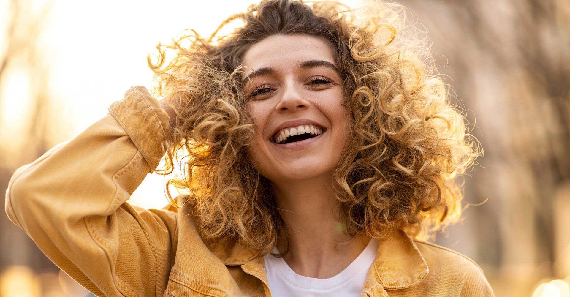 Smiling Young Woman — Fort Gratiot, MI — Hamzavi Dermatology & Dermatology Specialists Smiling Young Woman — Fort Gratiot, MI — Hamzavi Dermatology & Dermatology Specialists