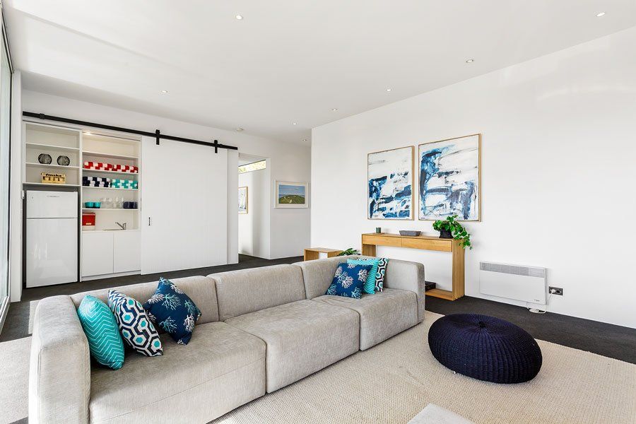 Gray Couch In Living Room — Rye, VIC — Quin Wyatt Building Designers