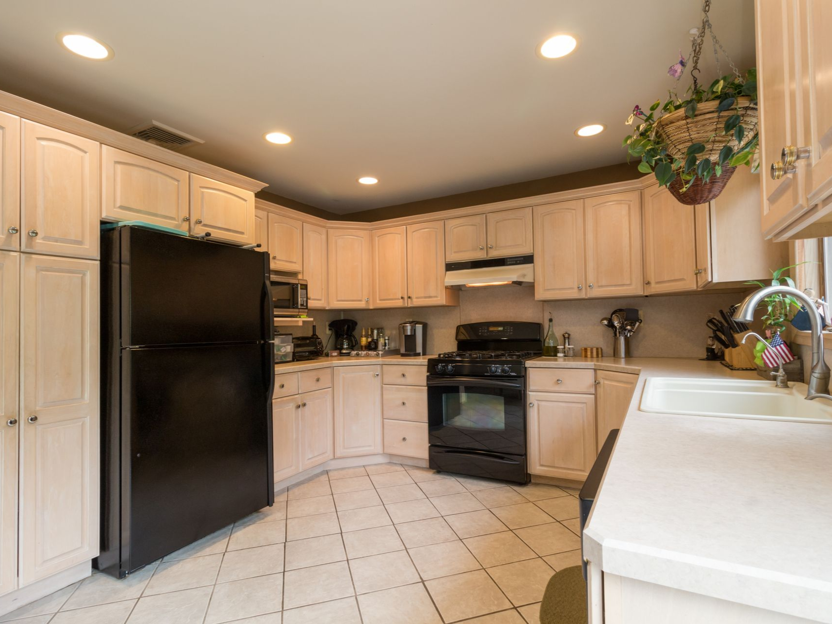 Recessed LED ceiling lights illuminating a residential kitchen