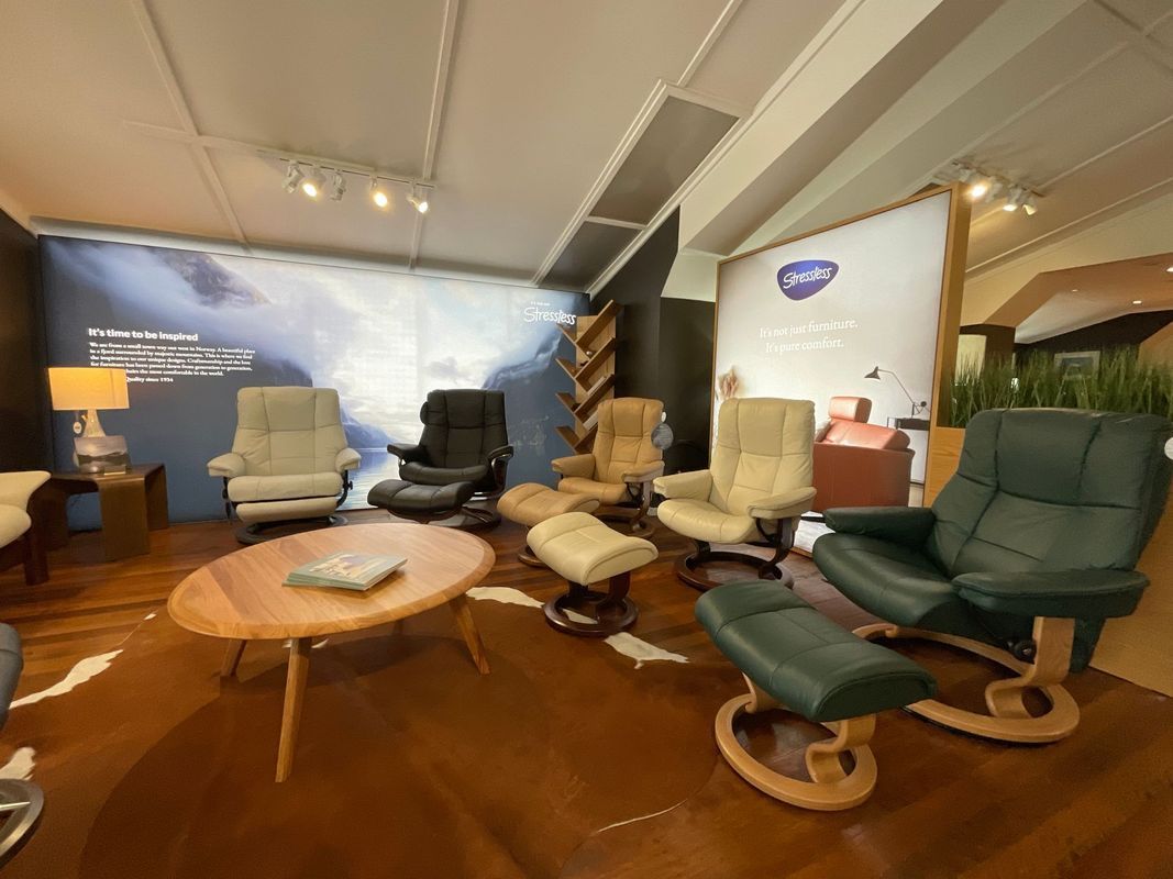 Reclining Chairs and Ottomans Displayed in a Showroom — Hastings Specialty Furniture In Port Macquarie, NSW