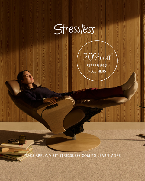 Woman Reclining in a Stressless Recliner With Her Feet Up — Hastings Specialty Furniture In Port Macquarie, NSW