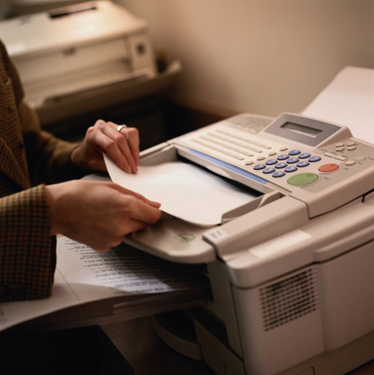 Close-Up of Businesswoman Faxing — El Paso, TX — One Stop Print Shop