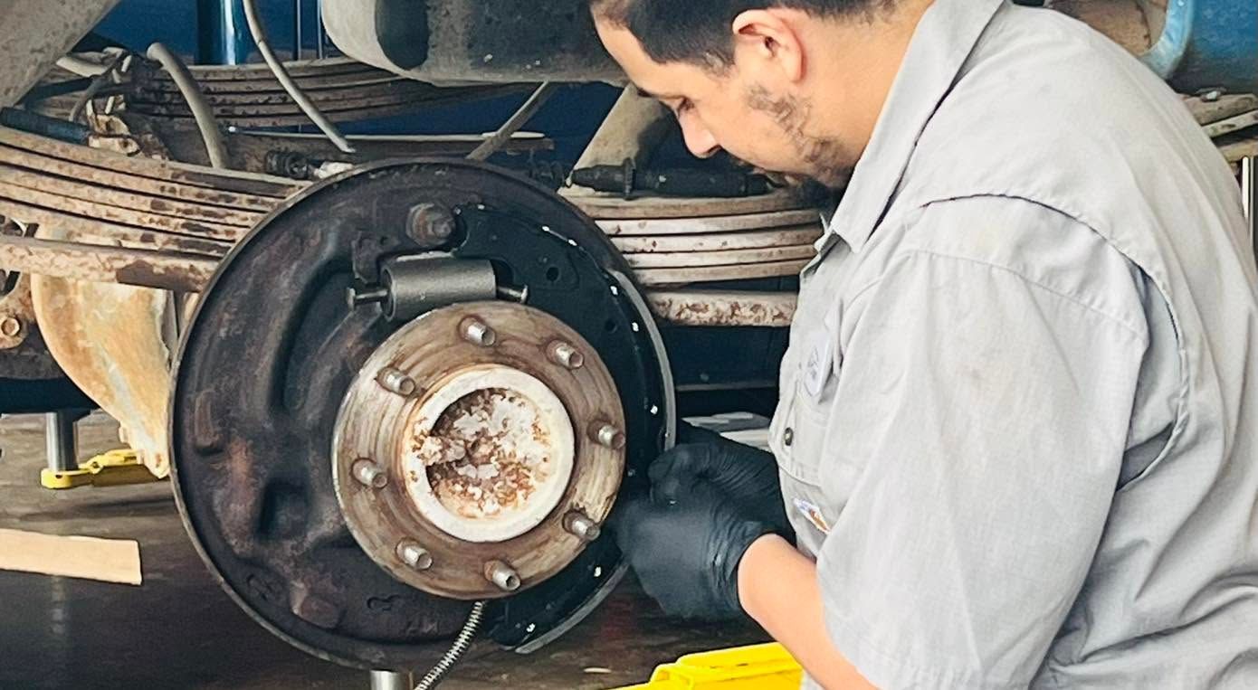 Automotive Technician Performing Brake And Wheel Hub Service | CarDoc Automotive