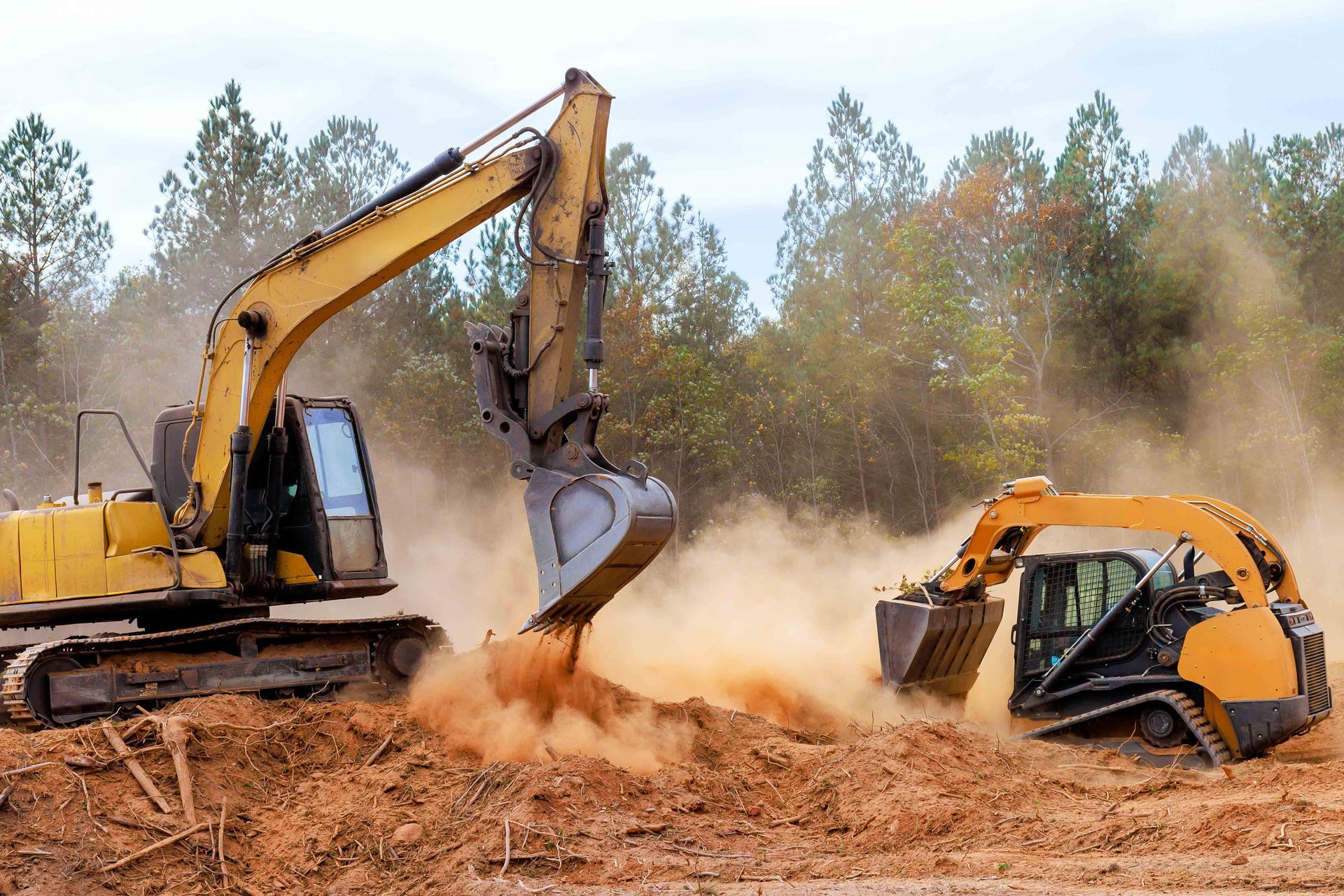 Excavator and bulldozer operating to prepare ground for construction project. Excavator and bulldozer operating to prepare ground for construction project.