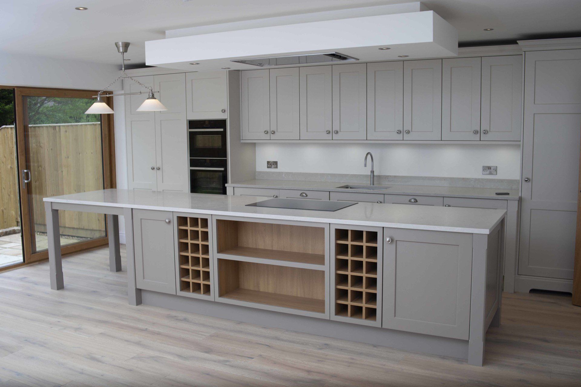 A kitchen with a large island and lots of cabinets
