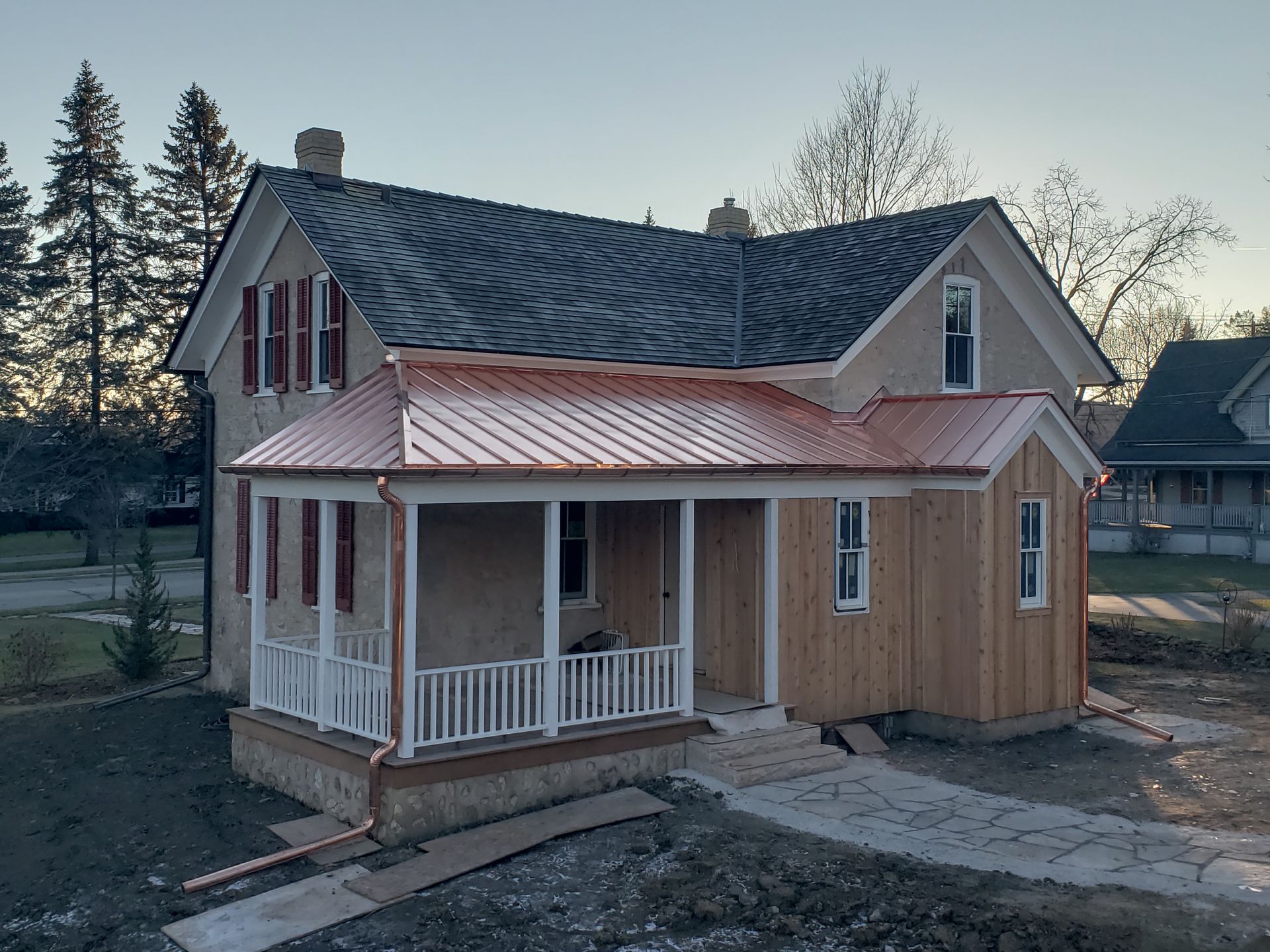 A brick chimney on top of a wooden roof