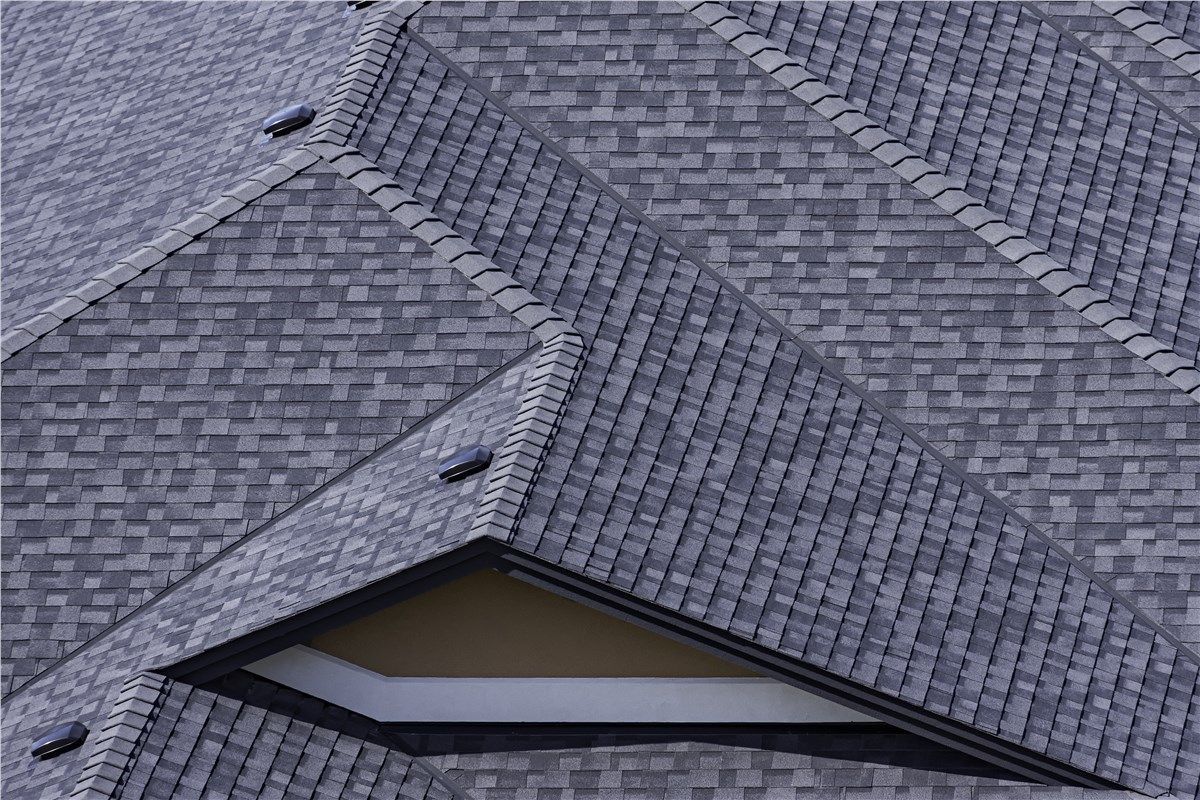 A close up of a roof with a window on it.