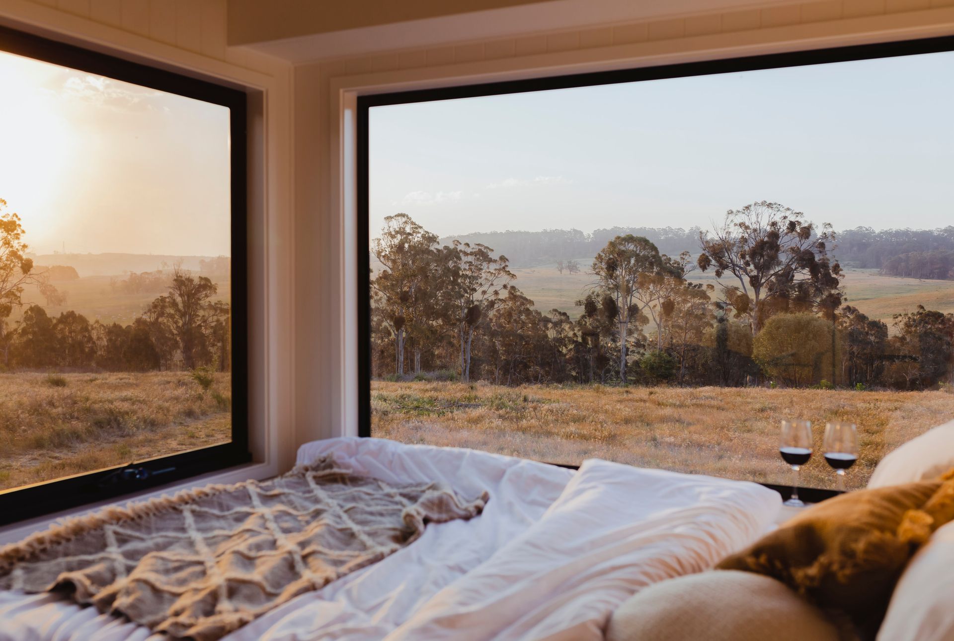 Bed With White Linens and Throw Blanket — Kellie O'Malley Conveyancing In Newcastle, NSW