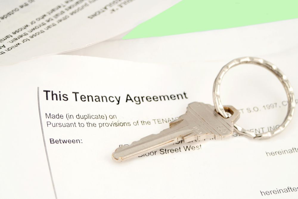 Key With a Ring Rests on a Tenancy Agreement Document — Kellie O'Malley Conveyancing In Lake Munmorah, NSW
