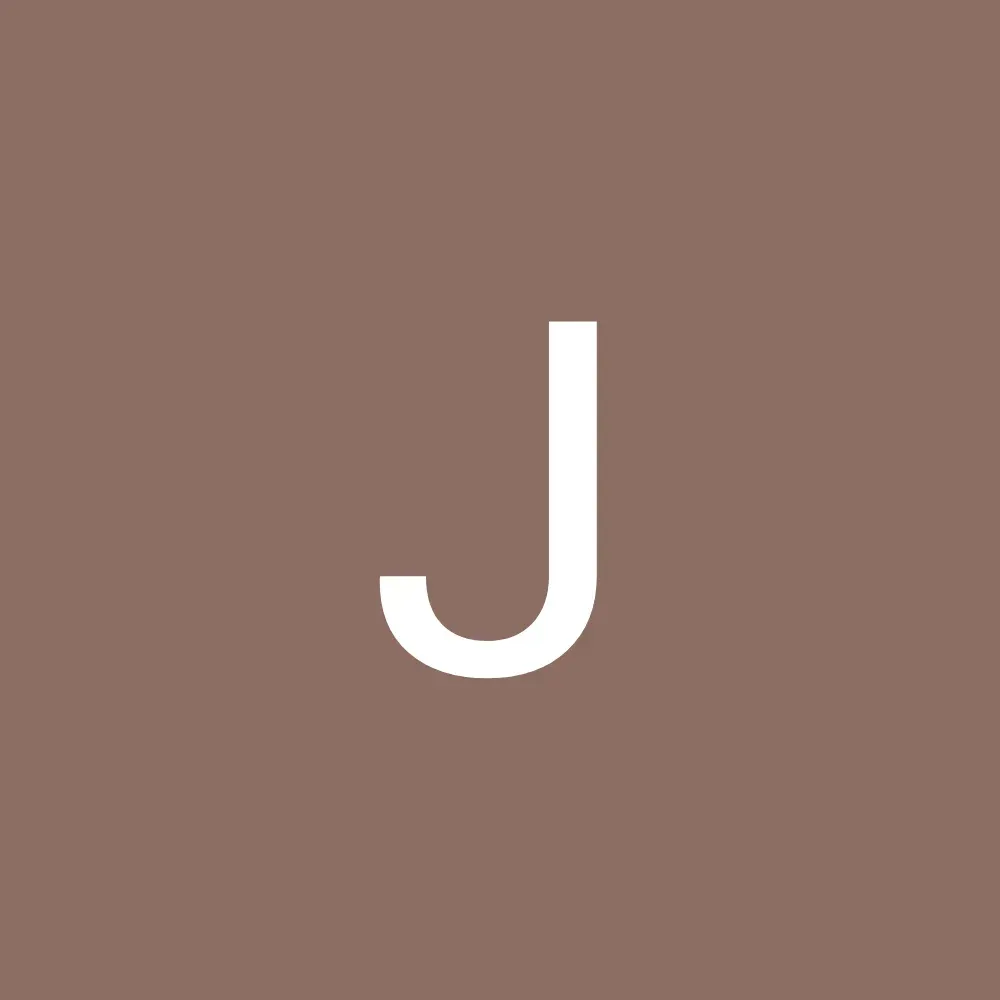 White letter “J” on a muted brown background.