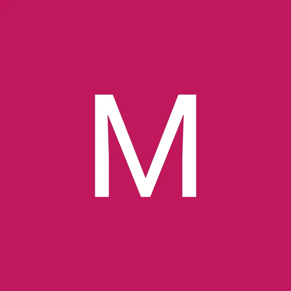 White letter “M” on a magenta background.