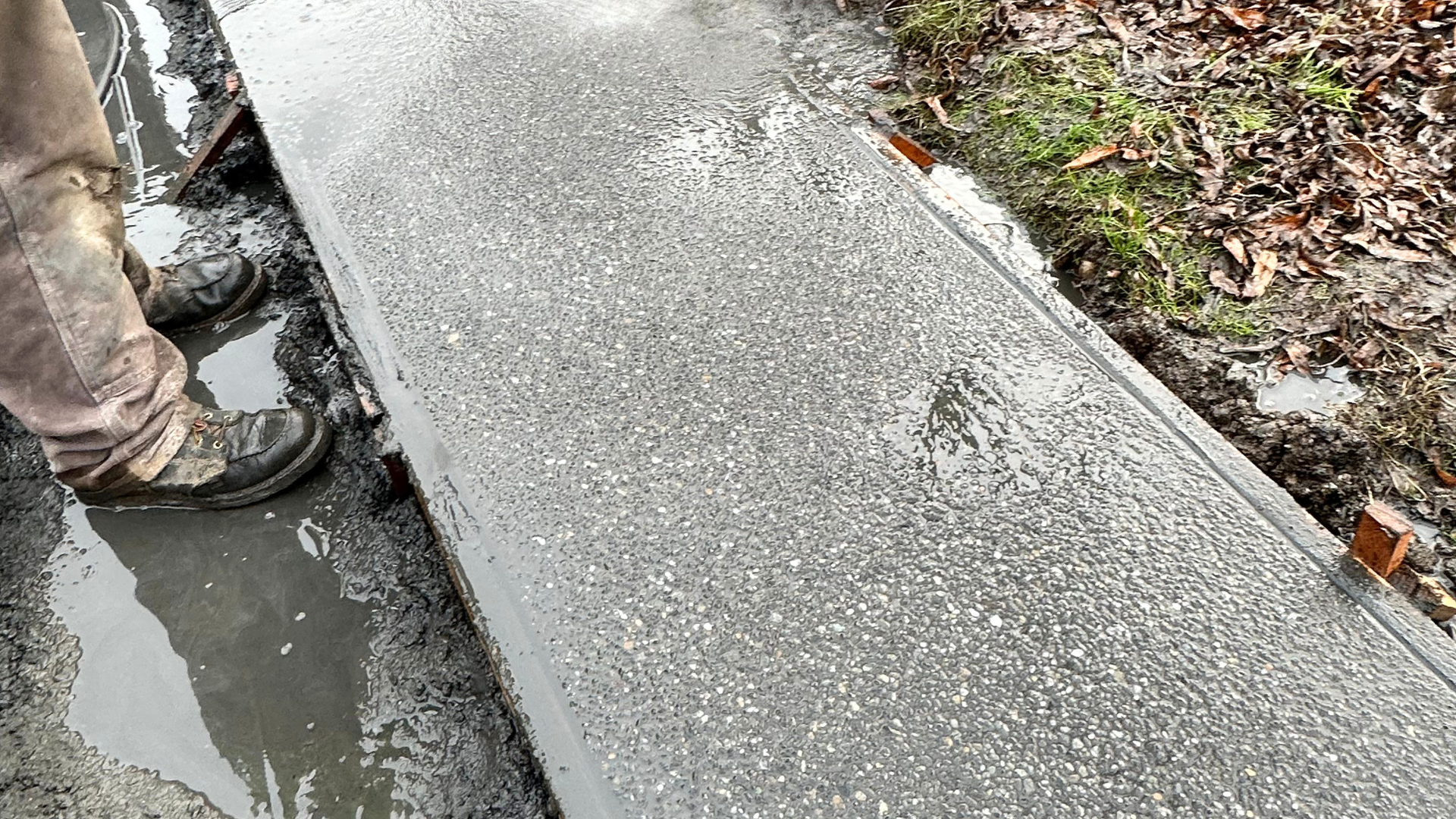 Exposed aggregate concrete walkway showing embedded stone for a naturally textured, slip-resistant surface in Whatcom County WA.