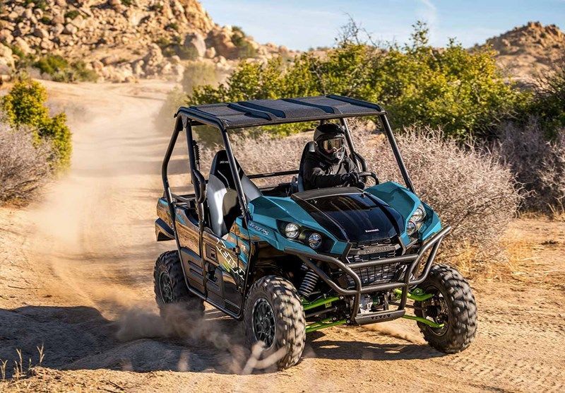 A Person is Riding an Atv on a Dirt Road — Mackay Kawasaki in North Mackay, QLD