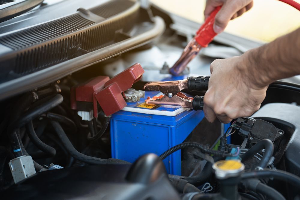 Mechanic jumping battery | Elite Autocare of Princeton