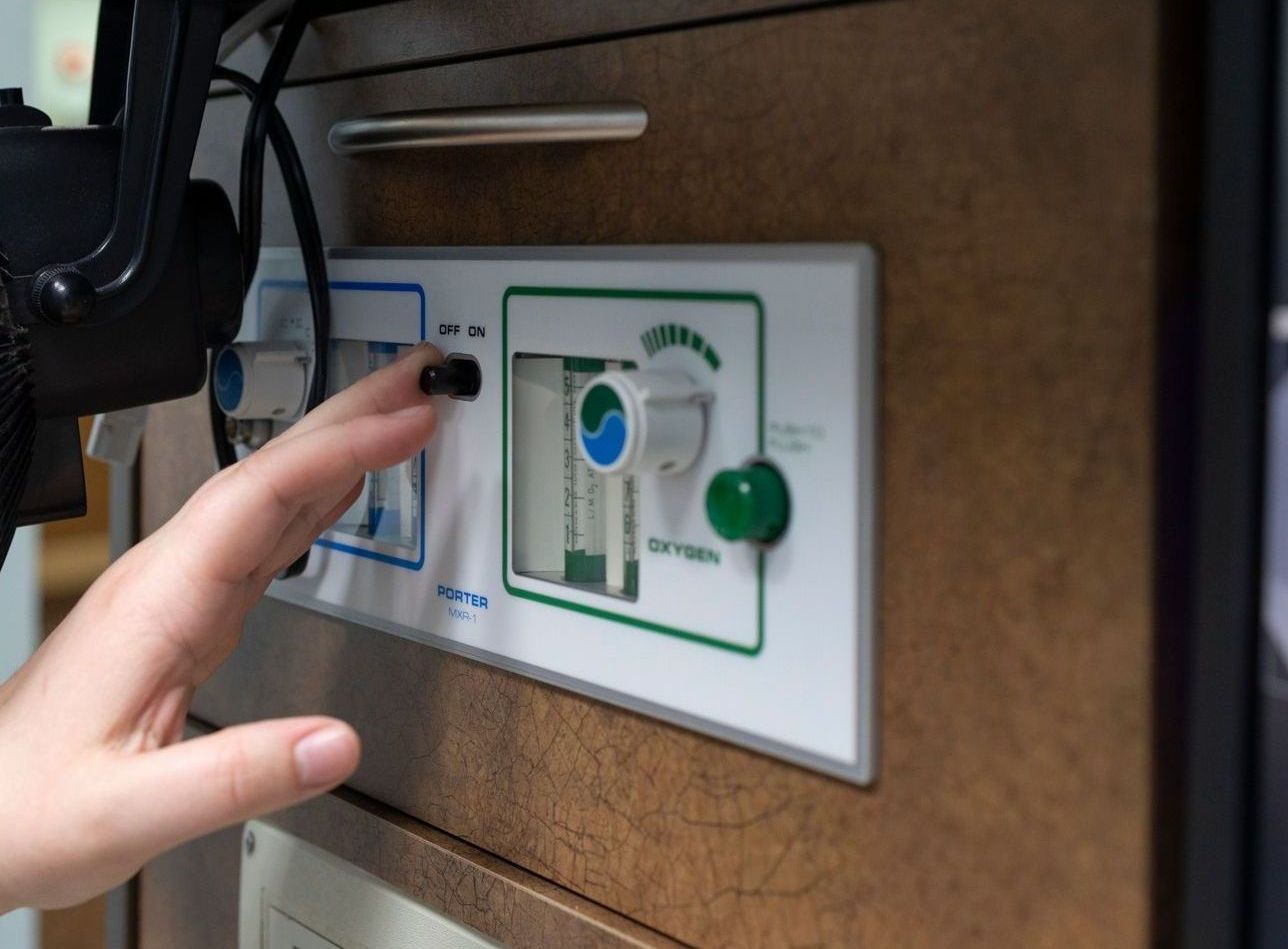 A person is pressing a button on a machine