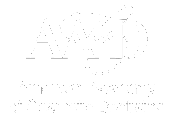 A white logo for the american academy of cosmetology dentistry.