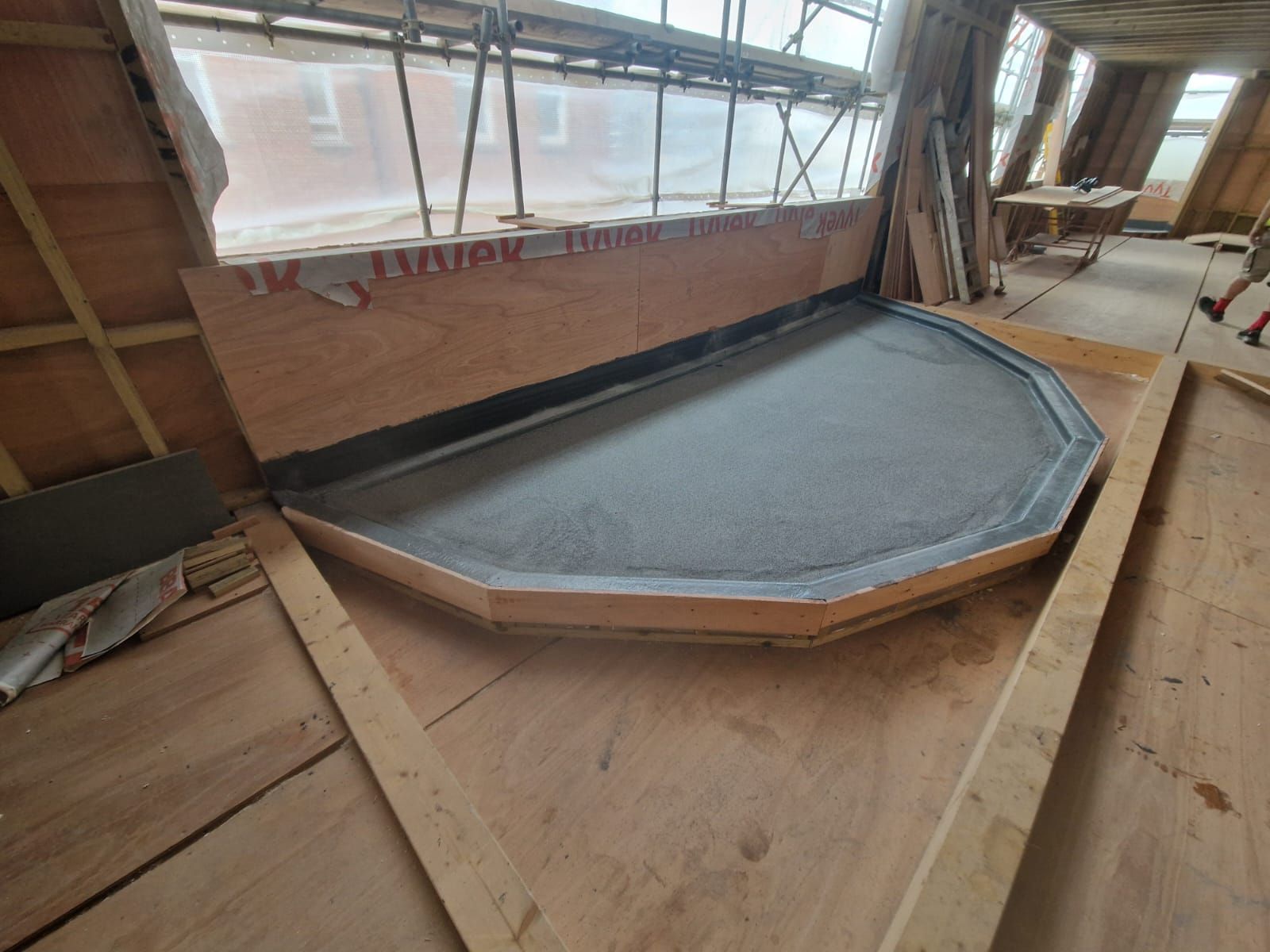 A wooden structure is being built in a building.