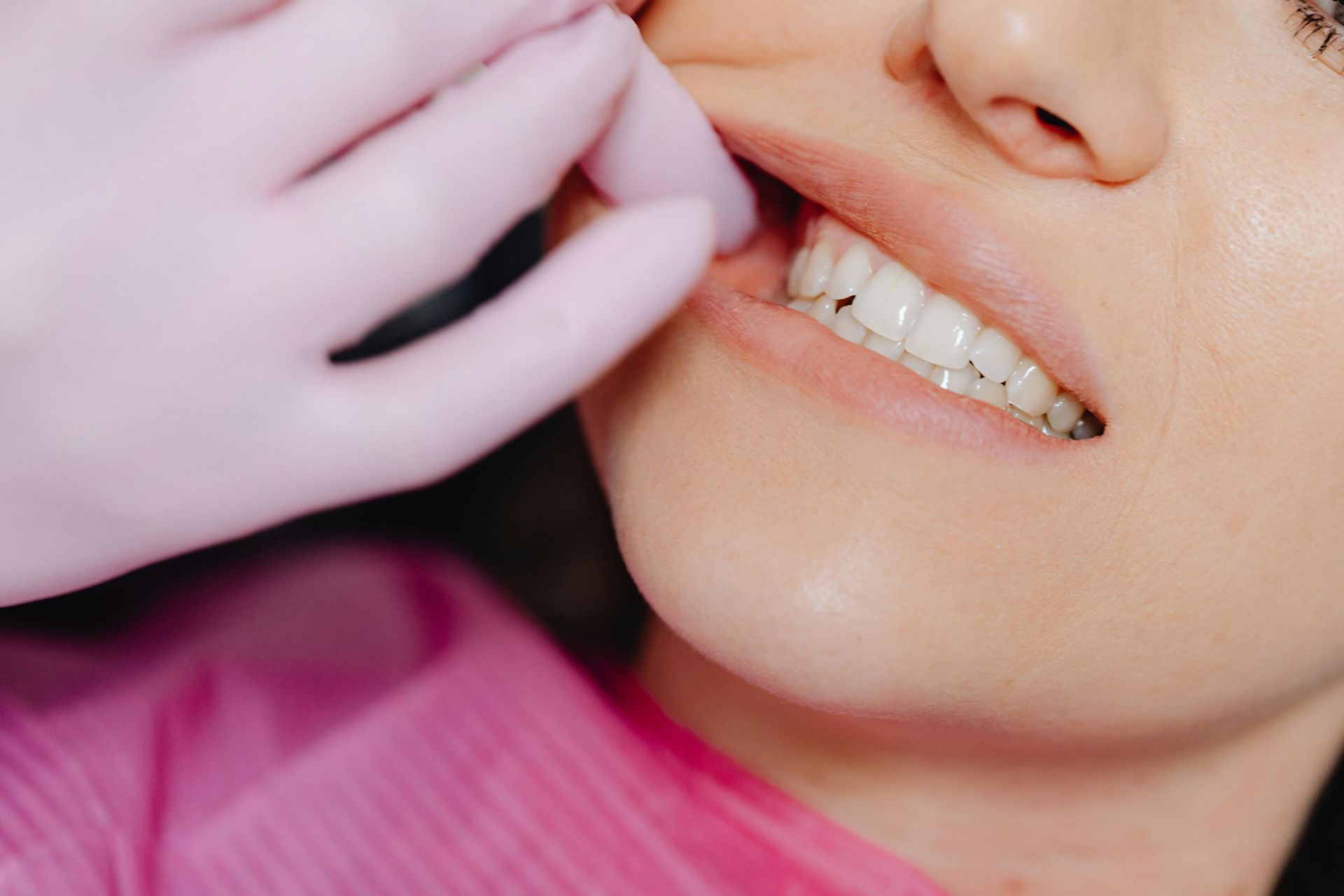 A womens teeth are smiling while at the dentist — Smiles on Hudson In Port Stephens, NSW