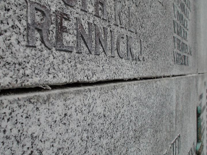 a stone wall with the name rennick on it