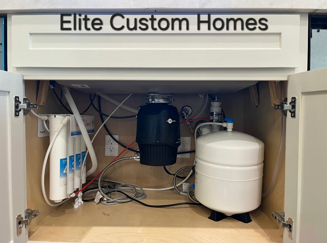 water filtration system installed below a sink in a new build home
