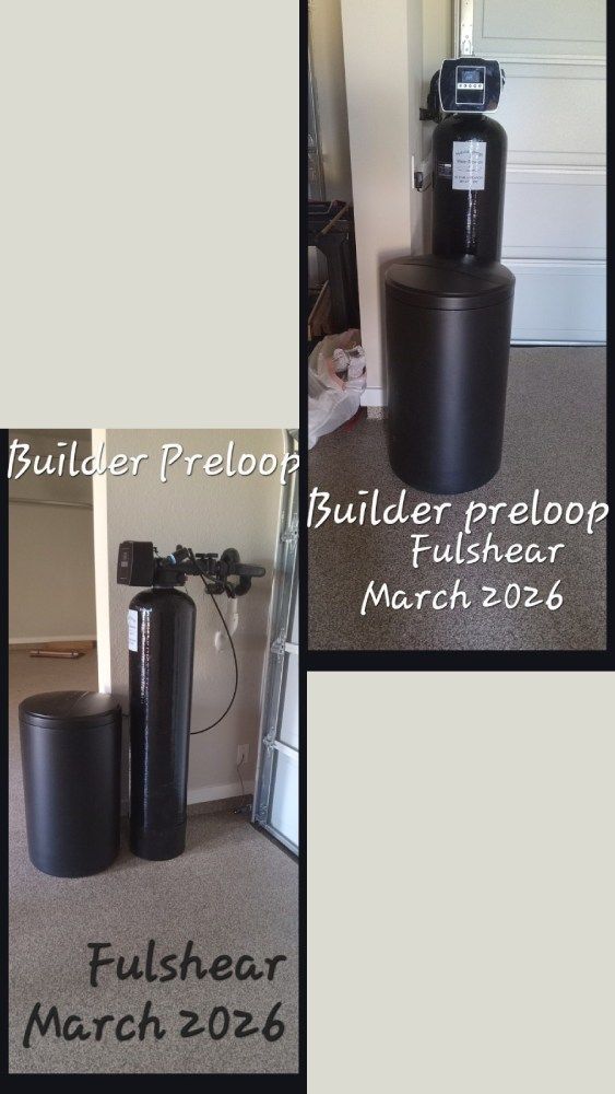 Two black water softener tanks labeled “Builder preloop” and “Pulshear March 2026” in a room