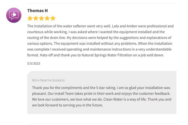 Customer review screenshot with 5-star rating and a thank-you message for a bathroom installation company