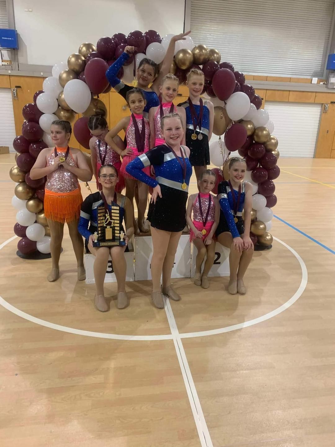 A Group Of Young Girls Are Posing For A Picture On A Basketball Court — International Dance Affair In North Mackay, QLD