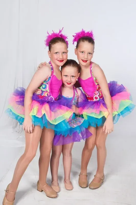 Three Young Girls In Colourful Tutus Are Posing For A Picture — International Dance Affair In North Mackay, QLD