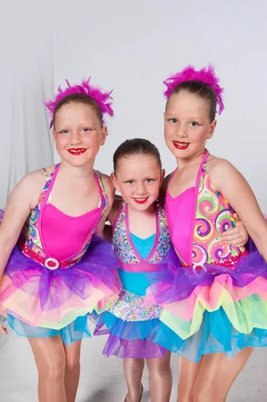 Three Young Girls In Colourful Tutus Are Posing For A Picture — International Dance Affair In North Mackay, QLD