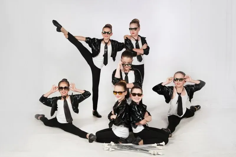 A Group Of Young Girls Wearing Suits And Ties Are Posing For A Picture — International Dance Affair In North Mackay, QLD