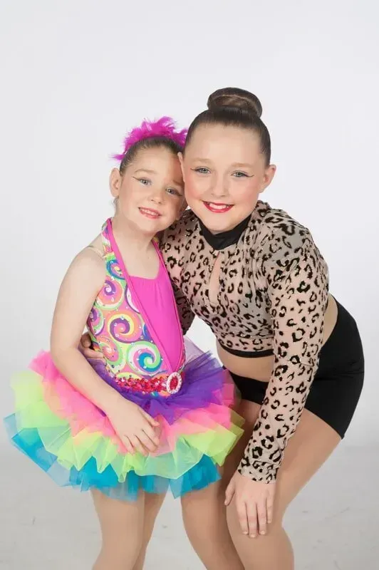 Two Young Girls In Colourful Dance Costumes Are Posing For A Picture — International Dance Affair In North Mackay, QLD