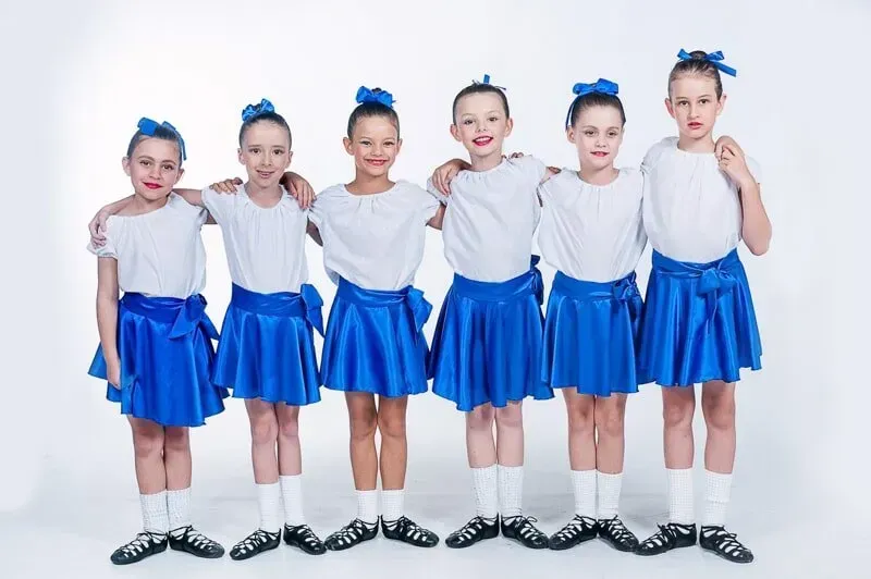 A Group Of Young Girls Wearing Blue Skirts And White Shirts — International Dance Affair In North Mackay, QLD