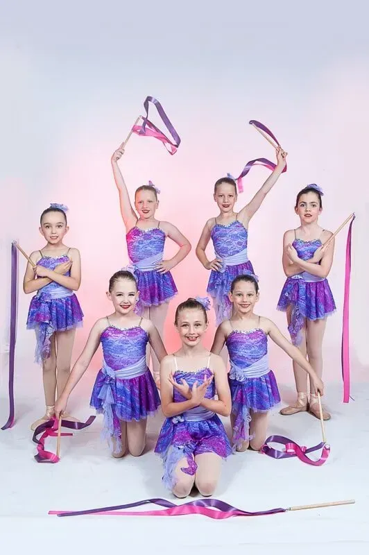 A Group Of Young Girls Are Posing For A Picture While Holding Ribbons — International Dance Affair In North Mackay, QLD