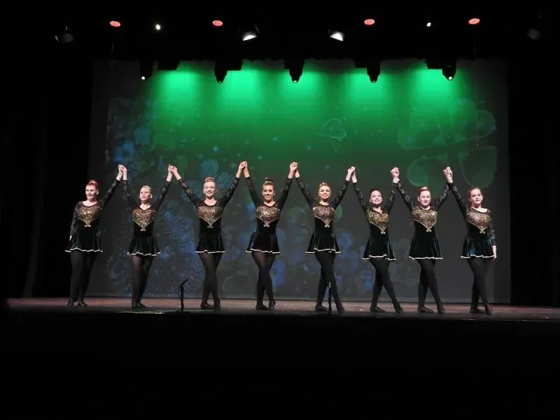 A Group Of Dancers Are Holding Hands On A Stage — International Dance Affair In North Mackay, QLD