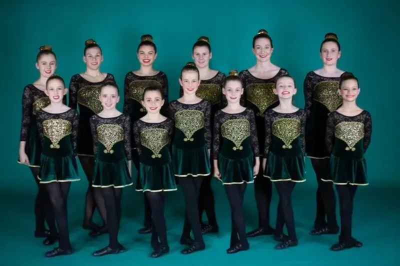 A Group Of Young Girls In Green And Gold Dresses Are Posing For A Picture — International Dance Affair In North Mackay, QLD