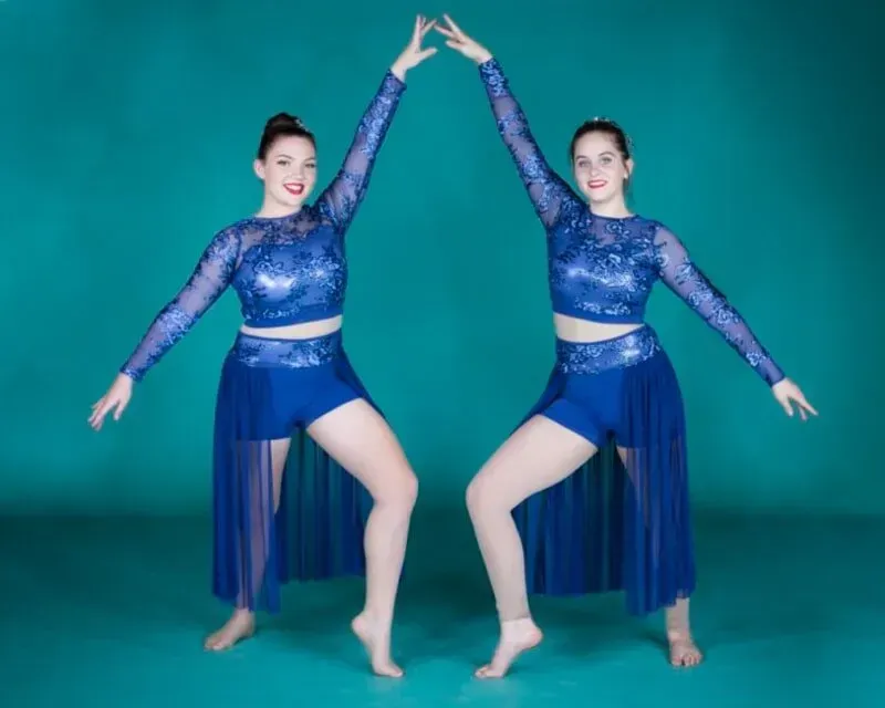 Two Dancers In Blue Outfits Are Giving Each Other A High Five — International Dance Affair In North Mackay, QLD