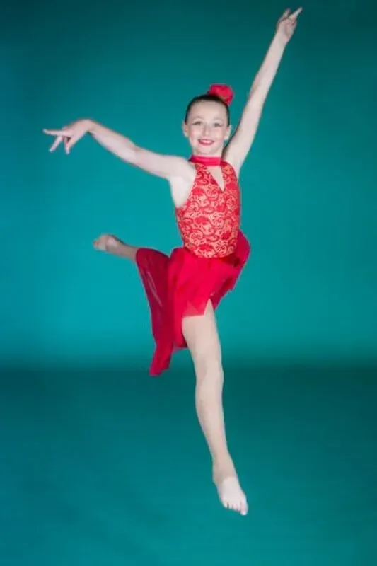 A Woman In Red Dress Is Dancing — International Dance Affair In North Mackay, QLD